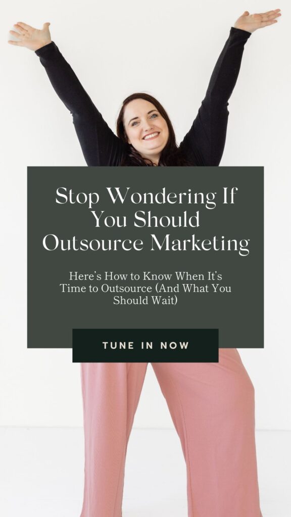 woman holding sign about whether to outsource your marketing