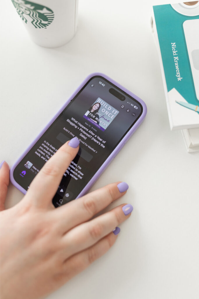 Pressing play on a podcast episode of The Kara Report that talks about growing your podcast with Pinterest and blog content.