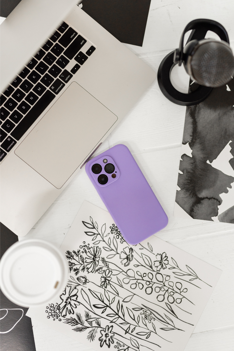 Flatlay of podcast equipment used by Kara from The Kara Report to record her post about how to pick podcast topics.